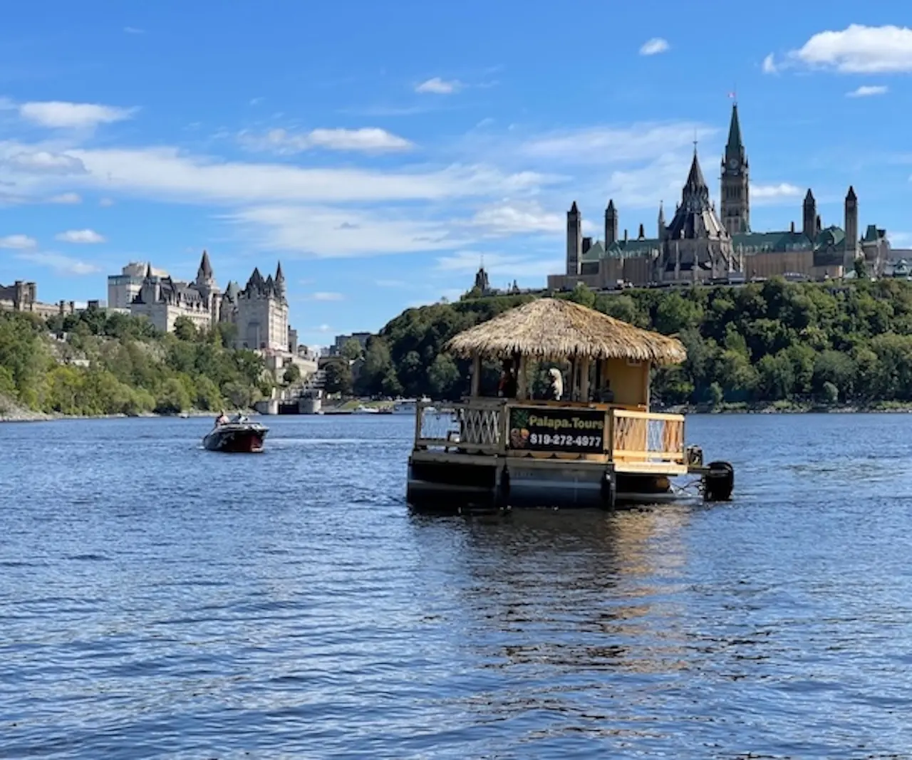 A Palapa floating tiki bar on the Ottawa River below Parliament Hill