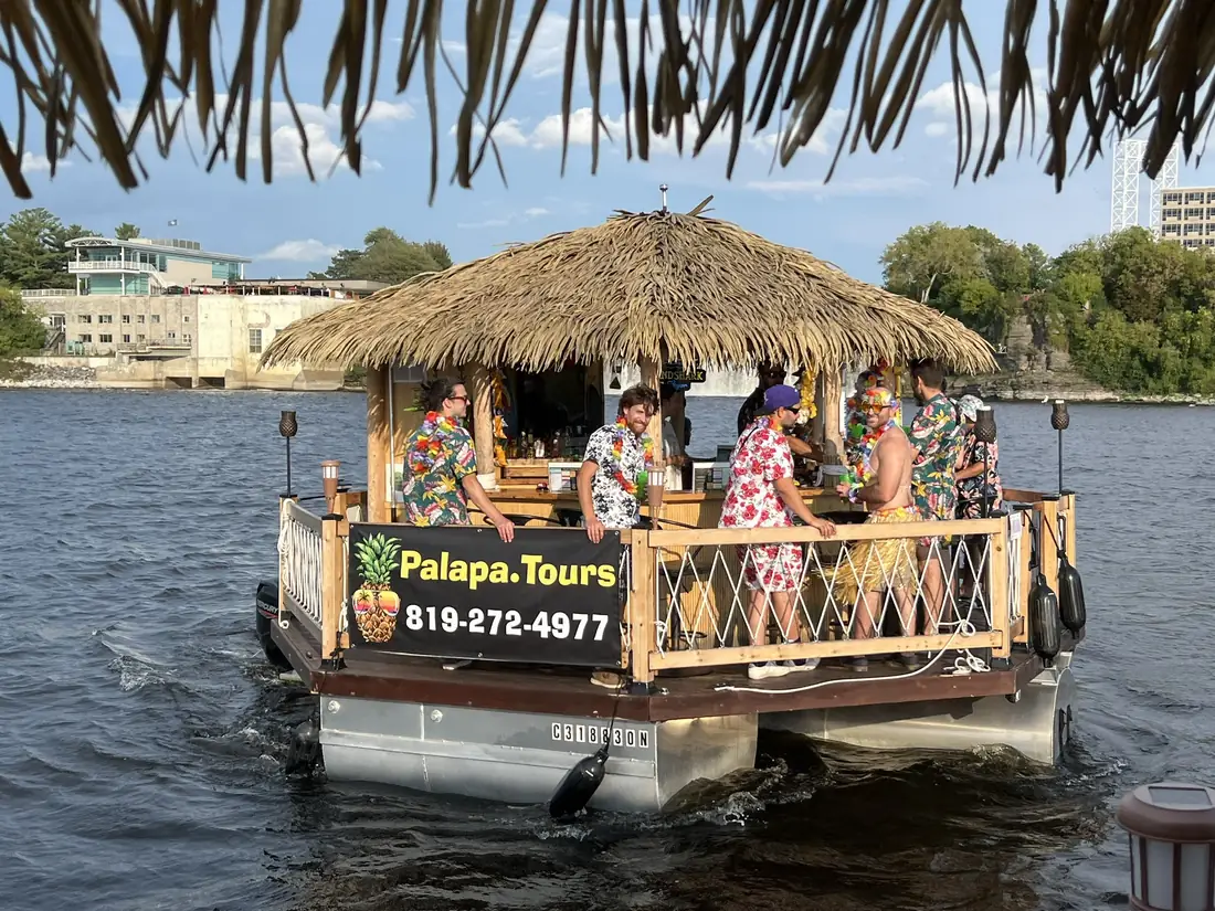 Guests in Hawaiian shirts on an Ottawa Palapa cruise